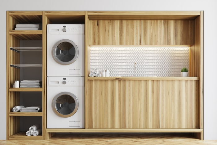 A combo dryer-washer setup in a laundry room