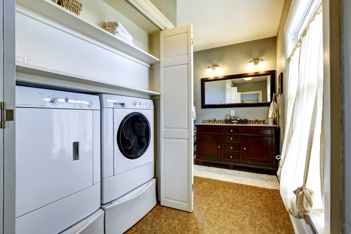 A condenser dryer in a narrow hallway