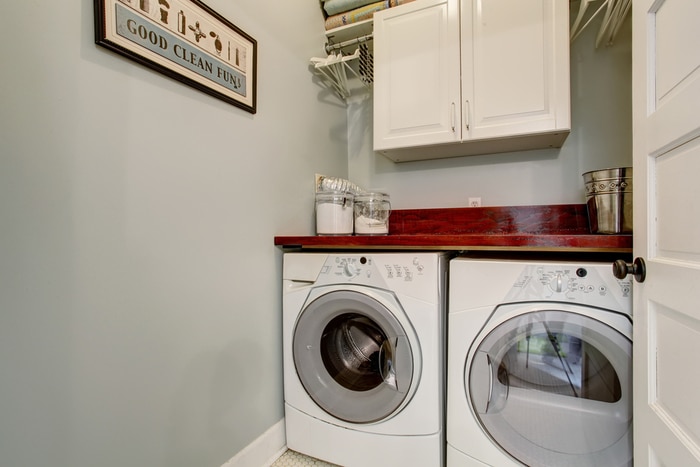 Heat pump dryers in a laundry room