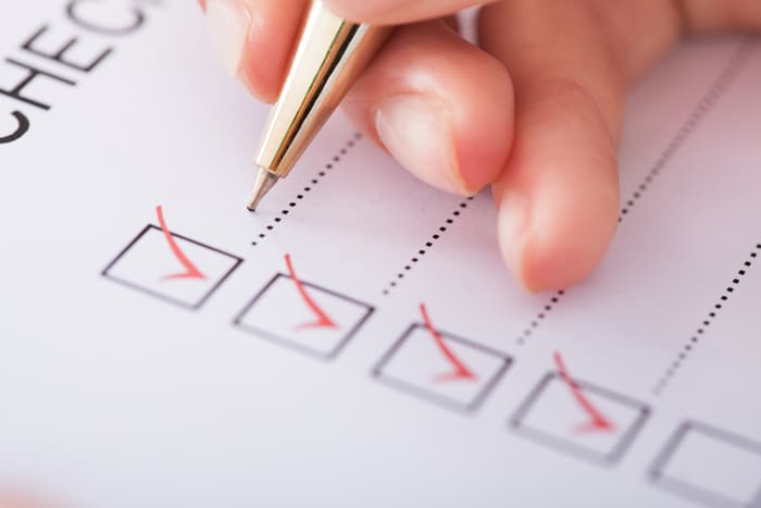 A person ticking a checklist