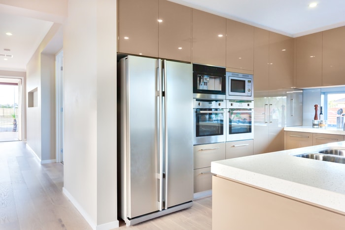 A side-by-side refrigerator in a wide kitchen