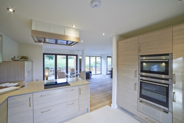 A wall oven in a wide kitchen