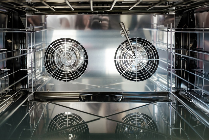 The fans inside a convection oven