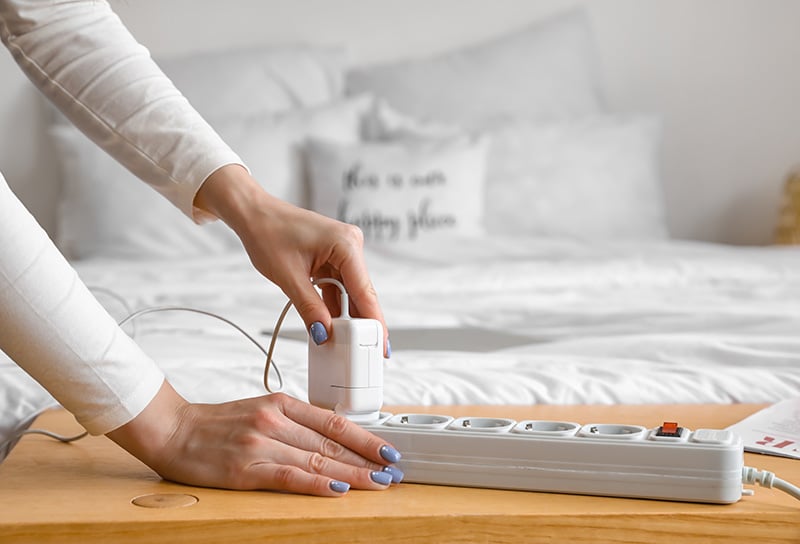 Plugging a cable into an extension cord