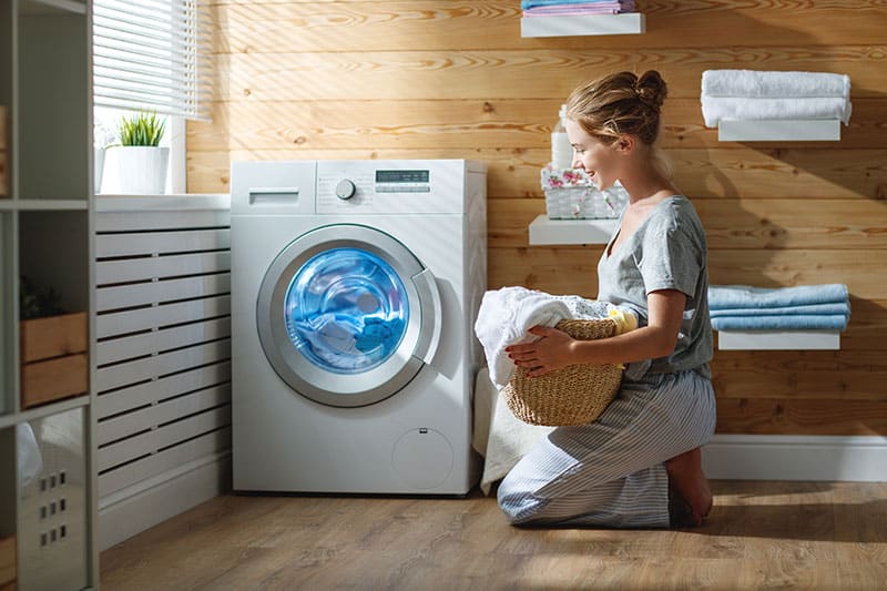 woman in front of washer
