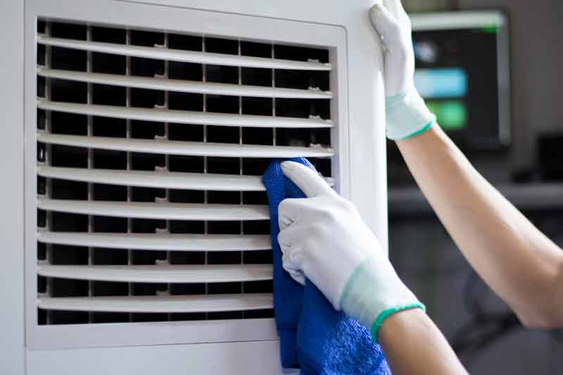 Hands Cleaning And Giving Maintenance to Portable Ac Unit