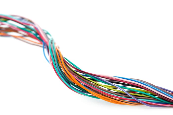 Different colored wires in a white background