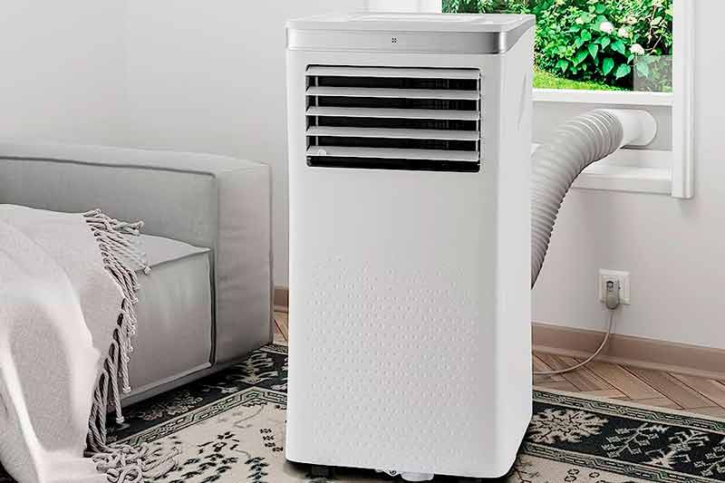 Portable air conditioner installed near a window.