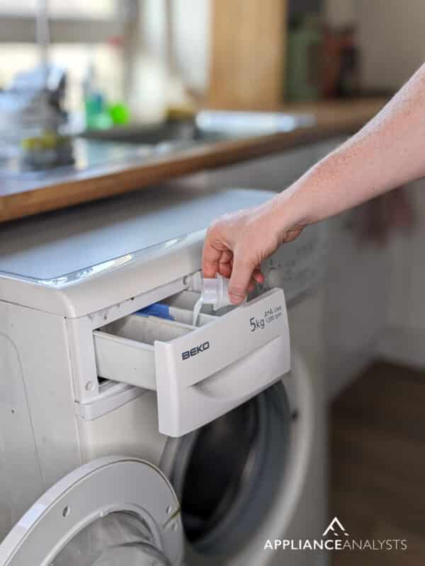 Adding soap to washing machine
