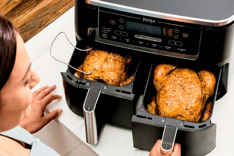 Woman Using Air Fryer Chicken Inside