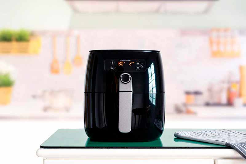 Front view of an air fryer on the kitchen countertop