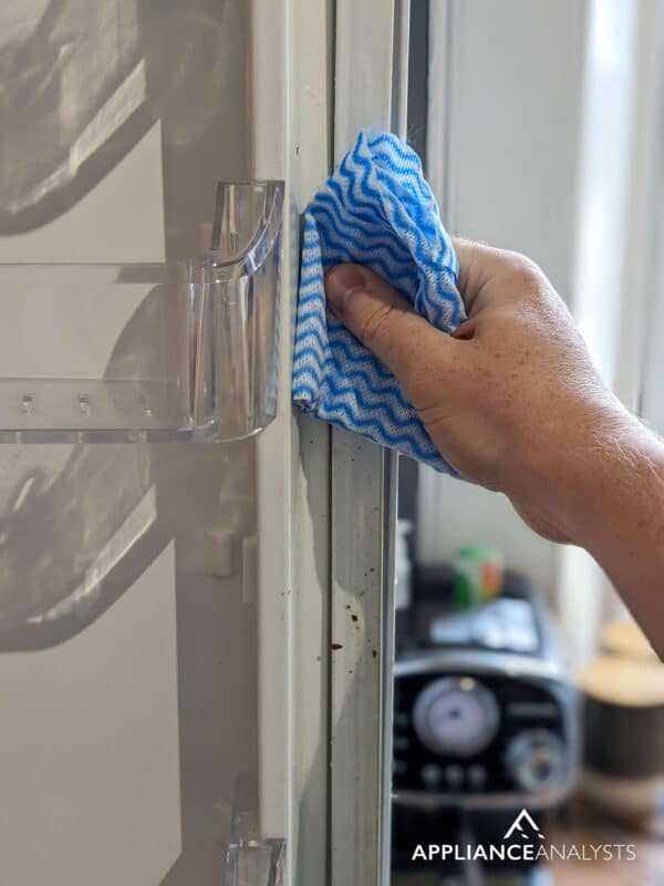 cleaning a fridge