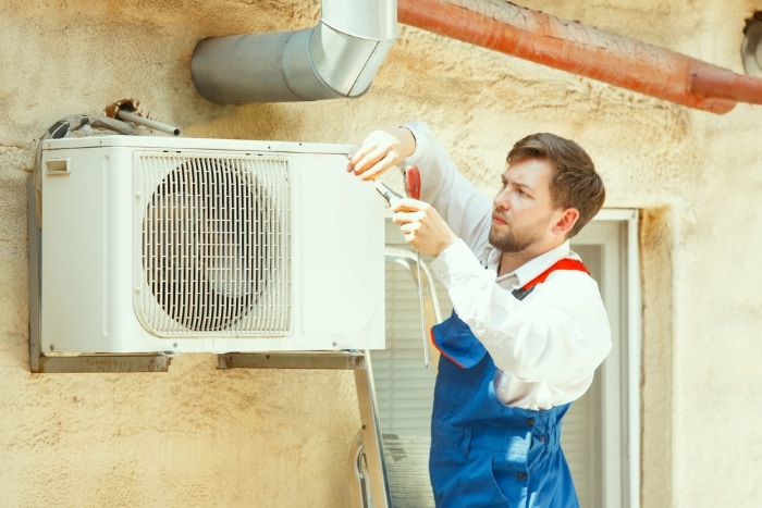 Technician working on an AC