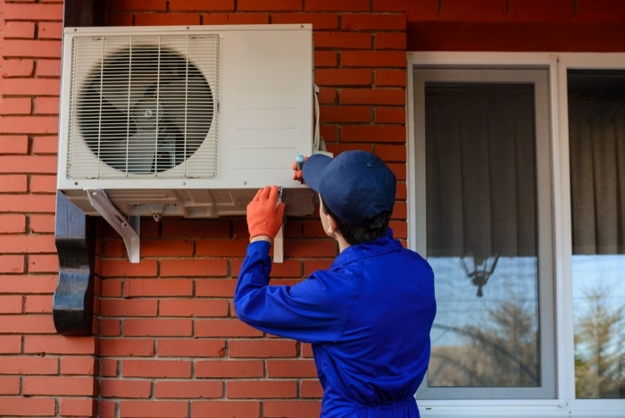 Technician working on Window AC