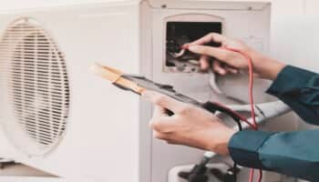 Technician working on a Window Air Conditioner
