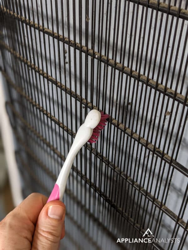 Cleaning fridge condenser coils