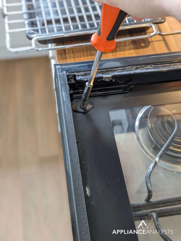 removing screws from oven door